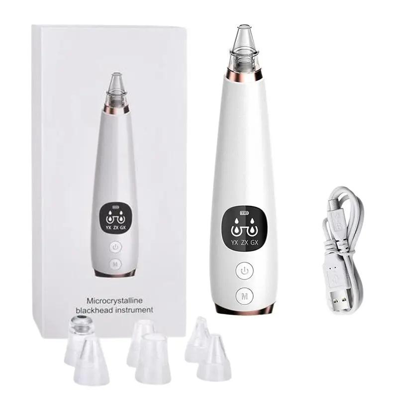 Electric blackhead remover device for deep pore cleansing with LCD display, USB charging cable, and multiple suction heads for skincare routine.
