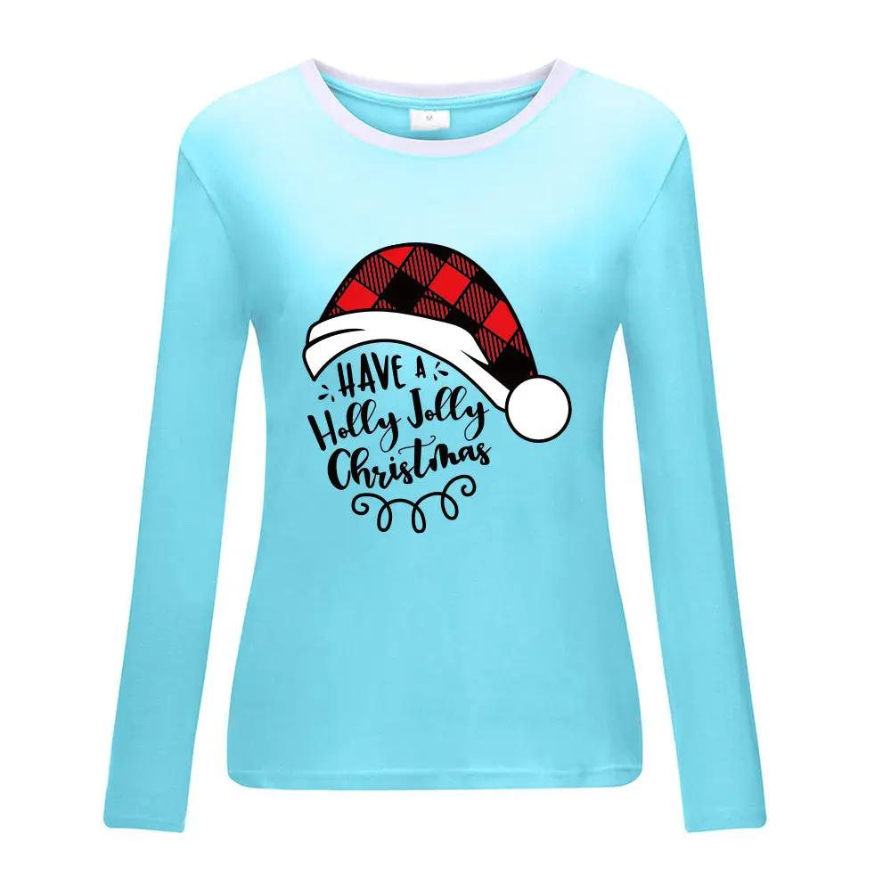 Light blue long sleeve shirt with Christmas hat print and cheerful holiday text, stylish and cozy for winter festivities.