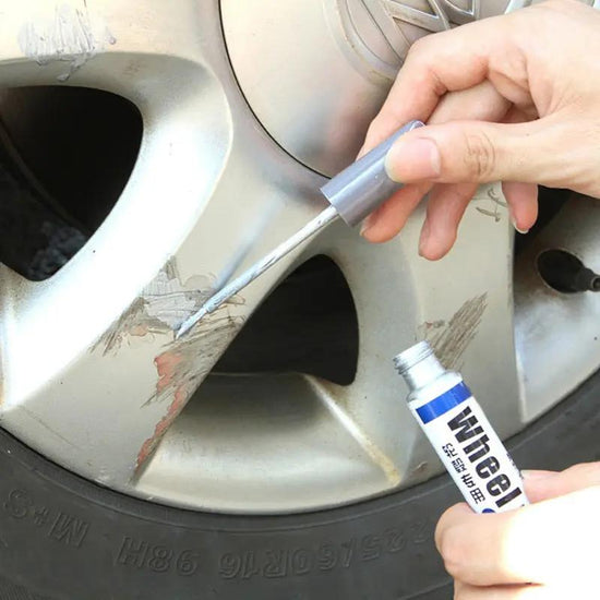 Waterproof Car Scratch Repair Pen for Tyre Tread Care being used to repair scratches on a car wheel.
