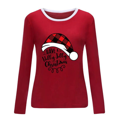 Red long sleeve shirt with white collar trim featuring a plaid Santa hat and holiday message, perfect for Christmas celebrations.